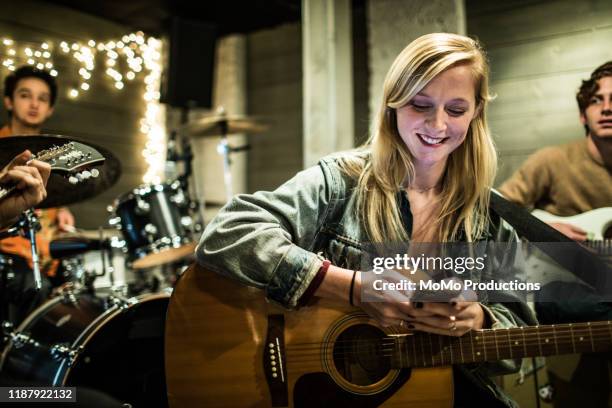 young rock band writing music together - zanger-en-componist stockfoto's en -beelden
