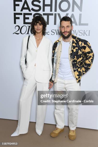 Mica Arganaraz and Simon Porte Jacquemus attend Vogue Fashion Festival Photocall At Hotel Potocki In Paris on November 15, 2019 in Paris, France.