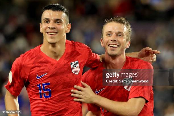 Alfredo Morales and Jackson Yueill of the United States celebrate a goal during the CONCACAF Nations League match against Canada at Exploria Stadium...