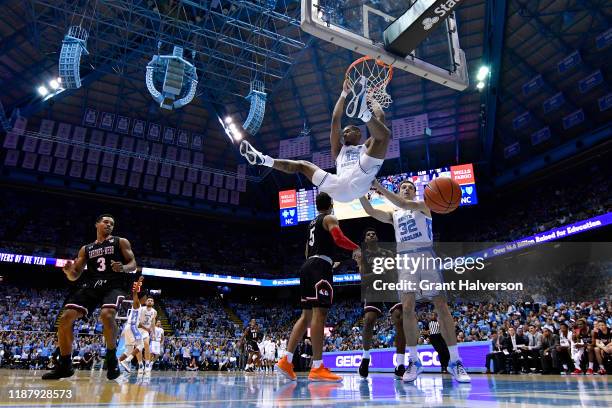 Garrison Brooks of the North Carolina Tar Heels dunks against the Gardner-Webb Runnin Bulldogs during the first half of their game at the Dean Smith...