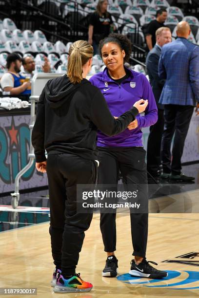 Lindsey Harding of the Sacramento Kings talks with Becky Hammon of the San Antonio Spurs before the game on December 6, 2019 at the AT&T Center in...