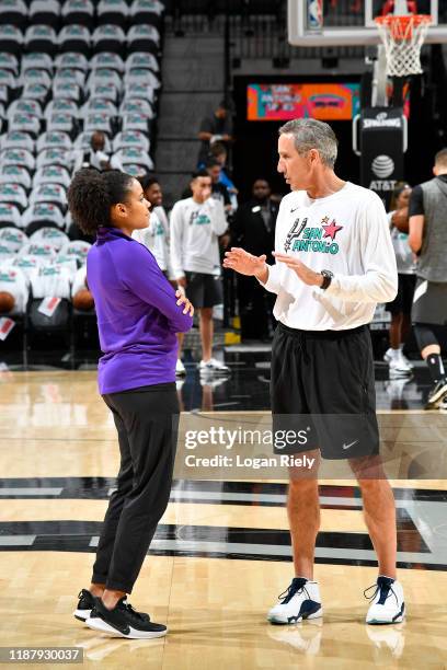 Lindsey Harding of the Sacramento Kings talks with Chip Engelland of the San Antonio Spurs before the game on December 6, 2019 at the AT&T Center in...