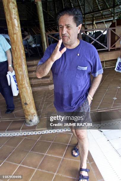 The president of Argentina Eduardo Duhlade is seen in his bathing suit on the beach of the Barcelo tourist resort in Punta Cana, 15 November 2002. A...