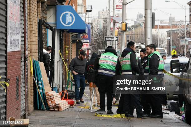 Demolition and recovery crew works at the scene of the December 10, 2019 shooting at a Jewish Deli on December 11, 2019 in Jersey City. - The...