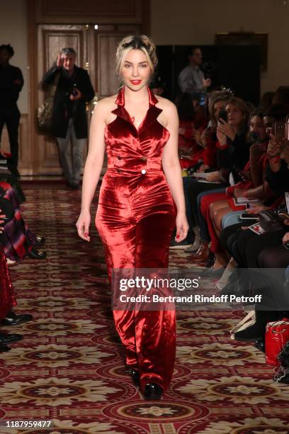 Actress Alix Benezech, dressed by Kristina Fidelskaya, walks the runway during the 3rd "Sauvez Le Coeur Des Femmes - Red Defile" show at Hotel...