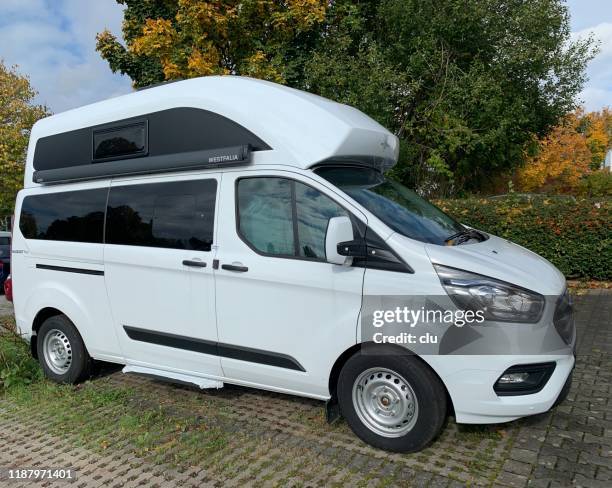 rv vehicle on public parking place - alcove stock pictures, royalty-free photos & images