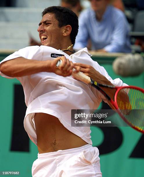 Guillermo Canas in action against Lleyton Hewitt, defeating him 6-7 , 7-6 , 6-4, 6-3.