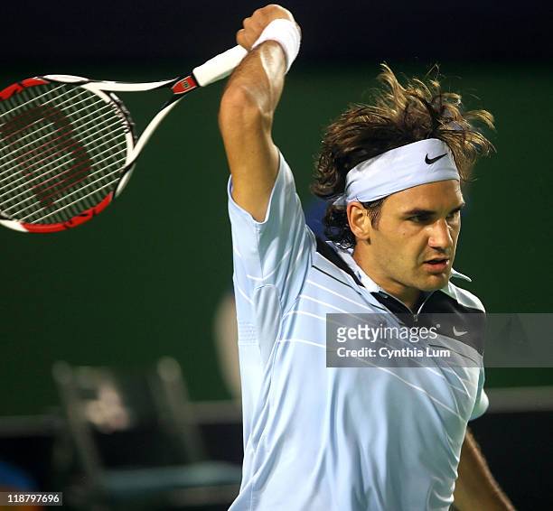 Roger Federer of Switzerland, in action during his third round match against Mikhail Youzhny of Russia at the Australian Open in Melbourne, Australia...