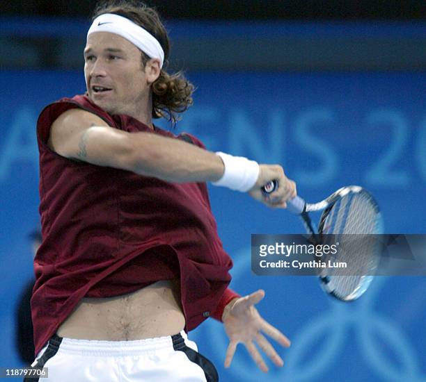 Carlos Moya in action against Ivo Karlovic in the third round of men's singles during the Athens 2004 Olympics Games at Goudi Olympic Hall in Athens,...