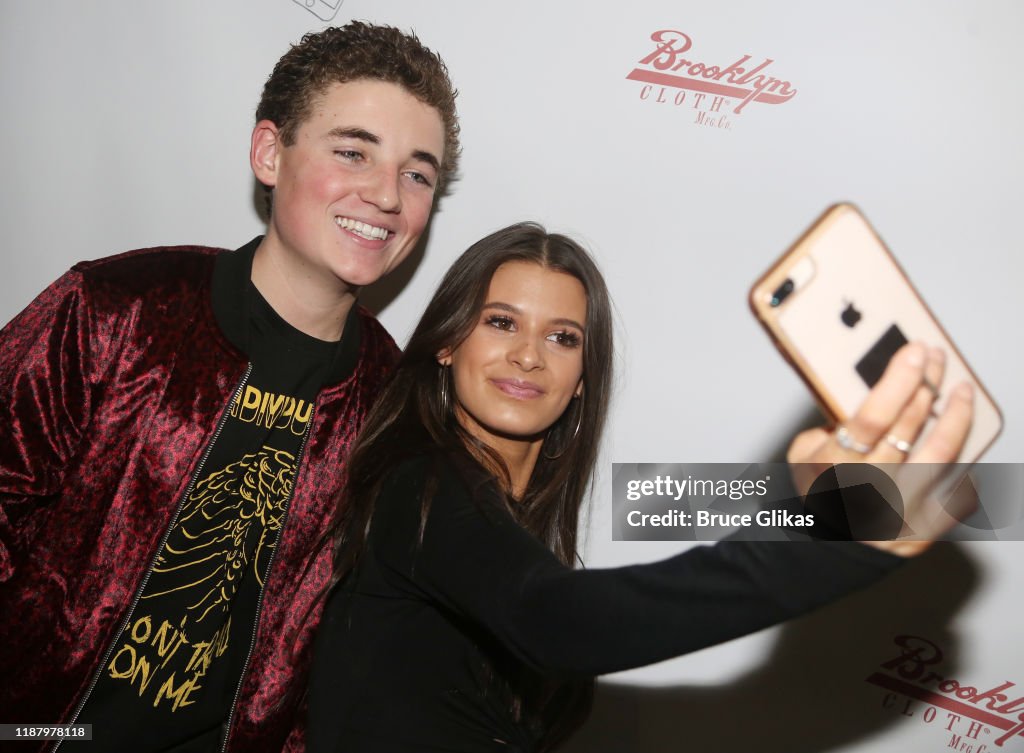 Ryan McKenna aka "The Selfie Kid" and Gianna Ferazi pose during a