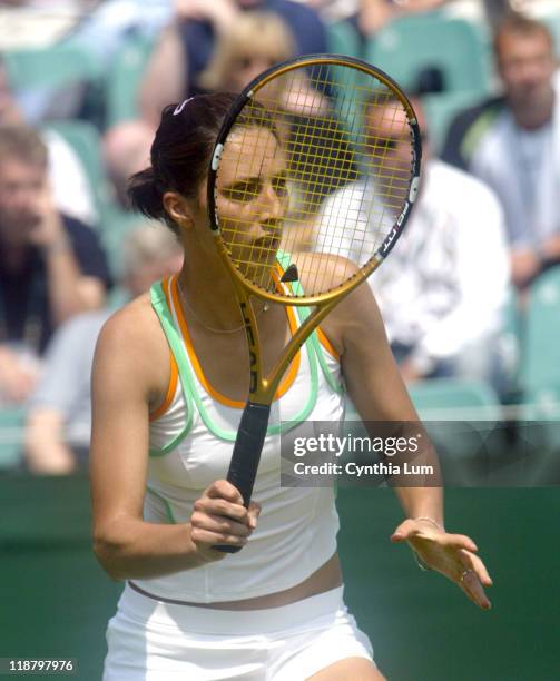 Anastasia Myskina at Wimbledon 2005 in London on June 20, 2005. Anastasia Myskina defeats Katerina Bohmova 5-7, 7-6 6-4 in the first round of the...