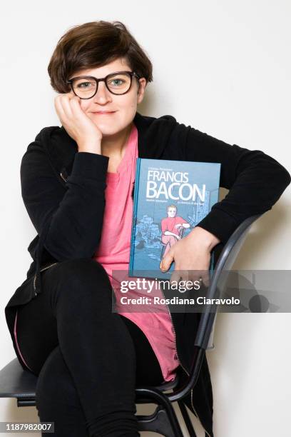 Cartoonist Cristina Portolano poses with her new graphic novel "Francis Bacon. La violenza di una rosa" during the Bookcity Milan 2019 on November...