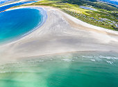 Aerial view of the awarded Narin Beach by Portnoo and Inishkeel Island in County Donegal, Ireland