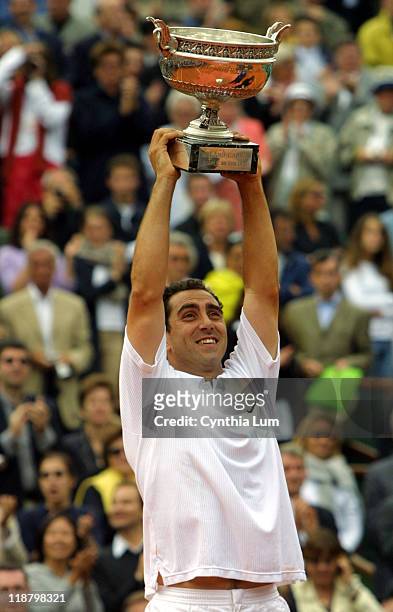 Albert Costa beats Juan Carlos Ferrero 6-1, 6-0, 4-6, 6-3 in the men's final of the 2002 French Open