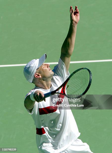 Andre Agassi serves against Sebastian Grosjean who retired after 2 games a because of stomach problems during their quarter final match January 27,...