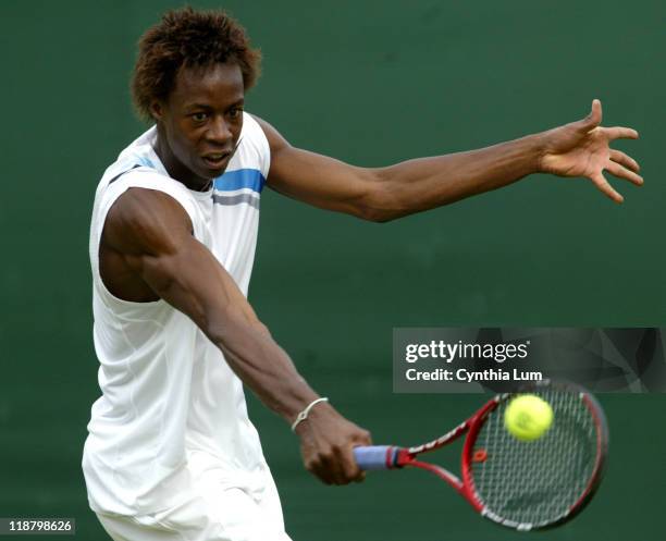 Gael Monfils, of France, in action, defeating Kristof Vliegen of Belgium, 7-5, 7-6, 7-6 int the second round of the Wimbledon Championships in...