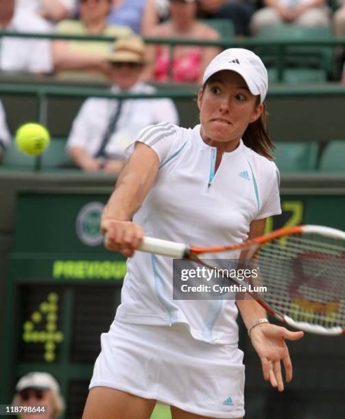 Justine Henin-Hardenne of Belgium defeating Severine Bremond of France, 6-4, 6-4 in the quarterfinal of the Wimbledon Championships at the All...