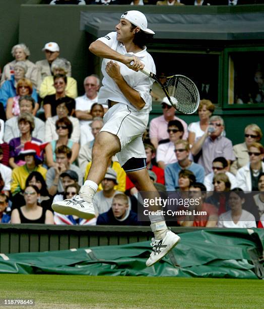 Frenchman Sebastien Grosjean during his Qurterfinal match against Great Britain's Tim Henman. Image from July 2, 2003 before rain delayed play.