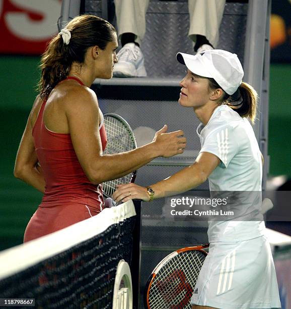Justine Henin-Hardenne and Amilie Mauresmo at the net as Mauresmo claims 2006 Australian Open title when at 6-1 2-0 when Justine Henin-Hardenne...