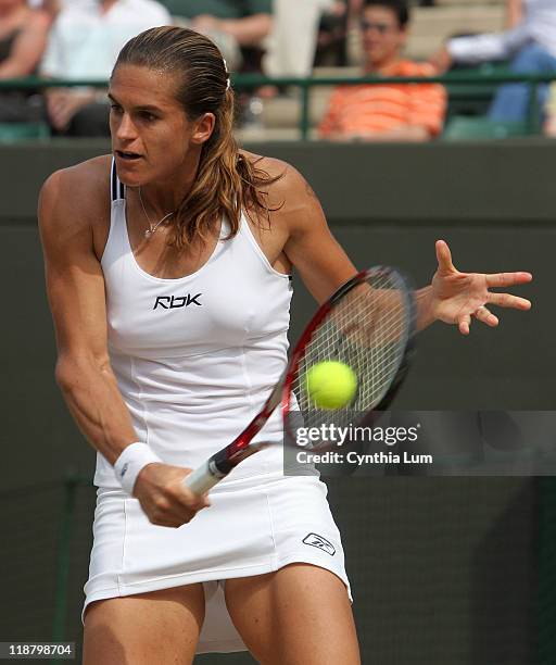 Amelie Mauresmo of France defeating Anastasia Myskina of Russia, 6-1, 3-6, 6-3, in the quarterfinal of the Wimbledon Championships at the All England...