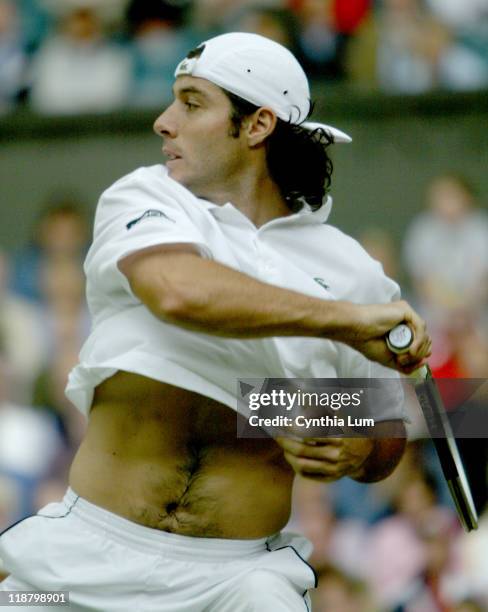 Frenchman Sebastien Grosjean during his Qurterfinal match against Great Britain's Tim Henman. Image from July 2, 2003 before rain delayed play.