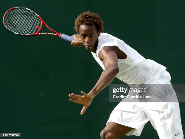 Gael Monfils, of France, in action, defeating Kristof Vliegen of Belgium, 7-5, 7-6, 7-6 int the second round of the Wimbledon Championships in...