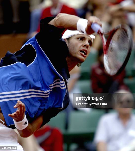 Paul-Henri Mathieu attacks the ball. Guillermo Canas defeated John Henri Mathieu 6-3, 7-6, 2-6, 6-7, 8-6 in the third round of the 2005 French Open...