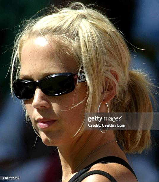 Bec Cartwright, watches as Lleyton Hewitt defeat Robin Vik 6-4, 2-6, 5-7, 7-6, 6-3 in the first round of the Australian Open at Melbourne Park in...