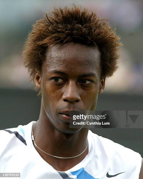 Gael Monfils, of France, in action, defeating Kristof Vliegen of Belgium, 7-5, 7-6, 7-6 int the second round of the Wimbledon Championships in...