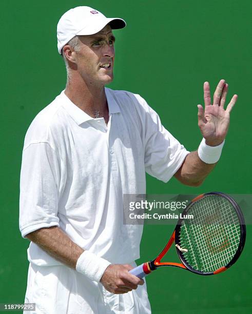 Todd Martin defeating newcomer Ivo Karlovic 7-6, 7-6, 7-6 in the second round of the Australian Open, Melbourne January 21, 2003.