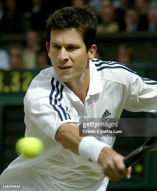 Great Britain's Tim Henman in play during his Quarterfinal match against Frenchman Sebastien Grosjean. Image from July 2, 2003 before rain delayed...