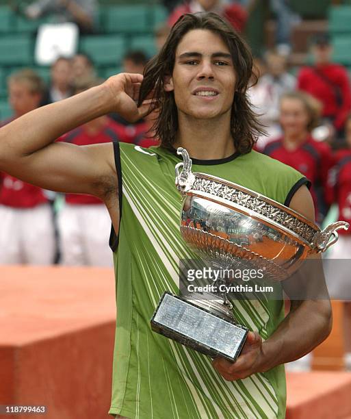Rafael Nadal with the trophy after winning the French Open title in Paris, defeating Mariano Puerta 6-7, 6-3, 6-1, 7-5 at Roland Garros in Paris,...