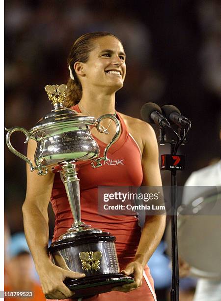 Amilie Mauresmo with trophy as she claims 2006 Australian Open title when at 6-1 2-0 when Justine Henin-Hardenne informed the chair umpire she could...