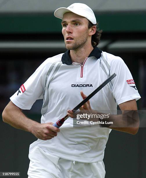 Ivo Karlovic of Croatia lost to Roger Federer of Switzerland 3-6, 6-7, 6-7 in the fourth round of the Wimbledon Championships in London, Great...