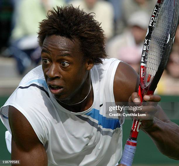 Gael Monfils, of France, in action, defeating Kristof Vliegen of Belgium, 7-5, 7-6, 7-6 int the second round of the Wimbledon Championships in...