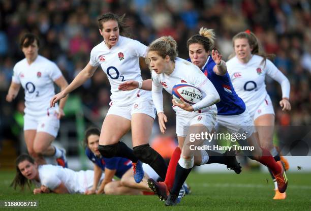 Abby Dow of England Women is tackled by Camille Boudaud of France Women during the Quilter International match between England Women and France Women...