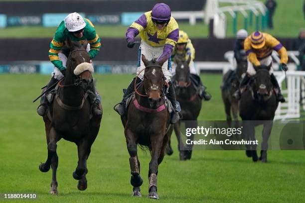 Richard Patrick riding Happy Diva clear the last to win The BetVictor Gold Cup Handicap Chase from Barry Geraghty and Brelan D'As at Cheltenham...
