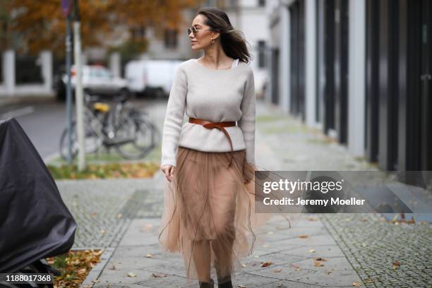 Anna Schürrle wearing Gianvito Rossi heels, Dorothee Schumacher skirt, Joseph sweater and Isabel Marant belt on November 16, 2019 in Berlin, Germany.