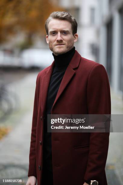 Andre Schürrle wearing Saint Laurent boots, Neuw pants, Sandro turtleneck and coat on November 16, 2019 in Berlin, Germany.