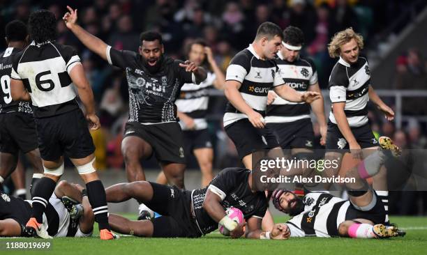 Johnny Dyer of Fiji drives over the line to score his sides third try during the Killik Cup match between Barbarians and Fiji at Twickenham Stadium...