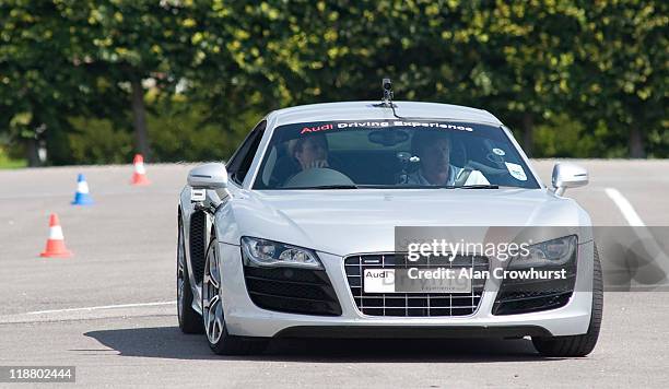 Jockey Hayley Turner enjoys driving an Audi R8 at the Preview to Glorious Goodwood Media Session at Goodwood Motor Circuit on July 11, 2011 in...