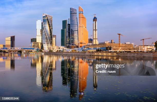 morning panorama of moscow international business center (moscow city) and calm moskva river, russia. - moscow skyline stock pictures, royalty-free photos & images