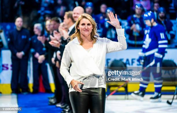 Hockey Hall of Fame inductee Hayley Wickenheiser waves to the crowd during a pre-game ceremony at the Scotiabank Arena on November 15, 2019 in...