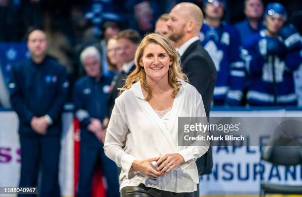 Hockey Hall of Fame inductee Hayley Wickenheiser waves to the crowd during a pre-game ceremony at the Scotiabank Arena on November 15, 2019 in...