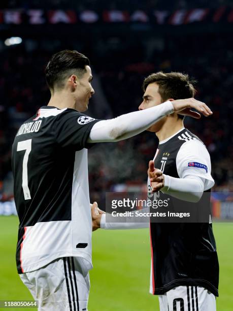 Cristiano Ronaldo of Juventus celebrates 0-1 with Paulo Dybala of Juventus during the UEFA Champions League match between Bayer Leverkusen v Juventus...