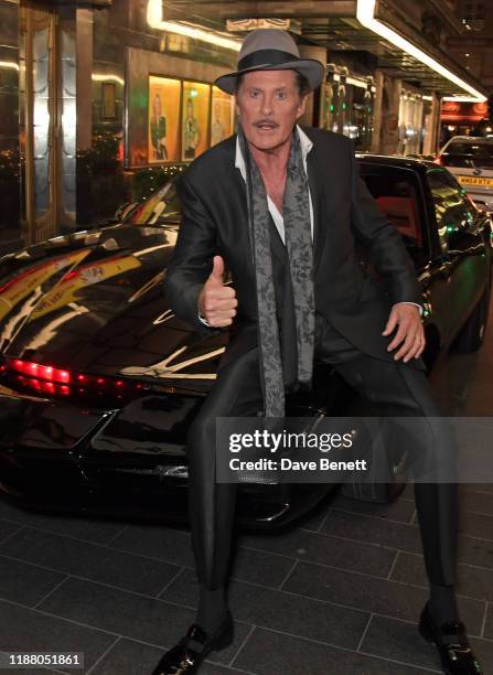 David Hasselhoff poses with KITT from Knight Rider at the gala party to celebrate David Hasselhoff joining the cast of the West End production of "9...