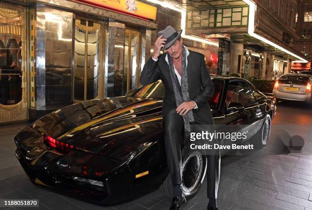 David Hasselhoff poses with KITT from Knight Rider at the gala party to celebrate David Hasselhoff joining the cast of the West End production of "9...