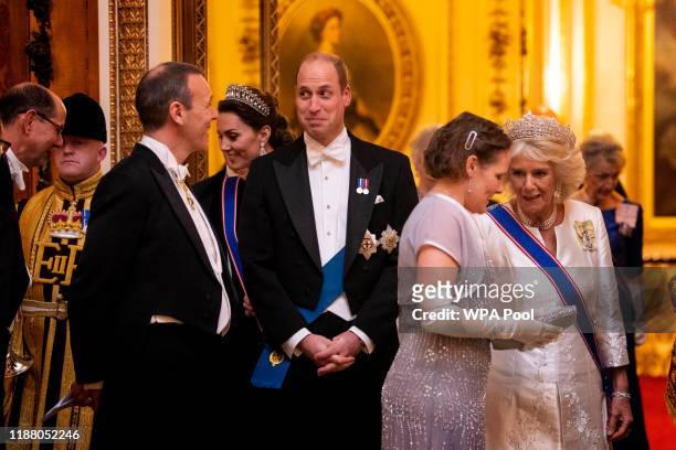 Catherine, Duchess of Cambridge, Prince William, and the Duchess of Cornwall at an evening reception for members of the Diplomatic Corps at...