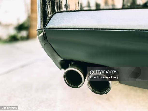 close-up of dirty exhaust pipes - bumper 個照片及圖片檔