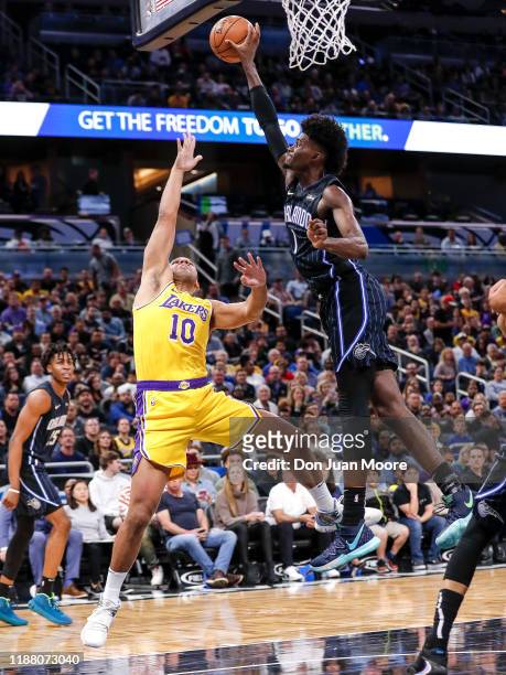 Jonathan Isaac of the Orlando Magic blocks the shot of Jared Dudley of the Los Angeles Lakers during the game at the Amway Center on December 11,...